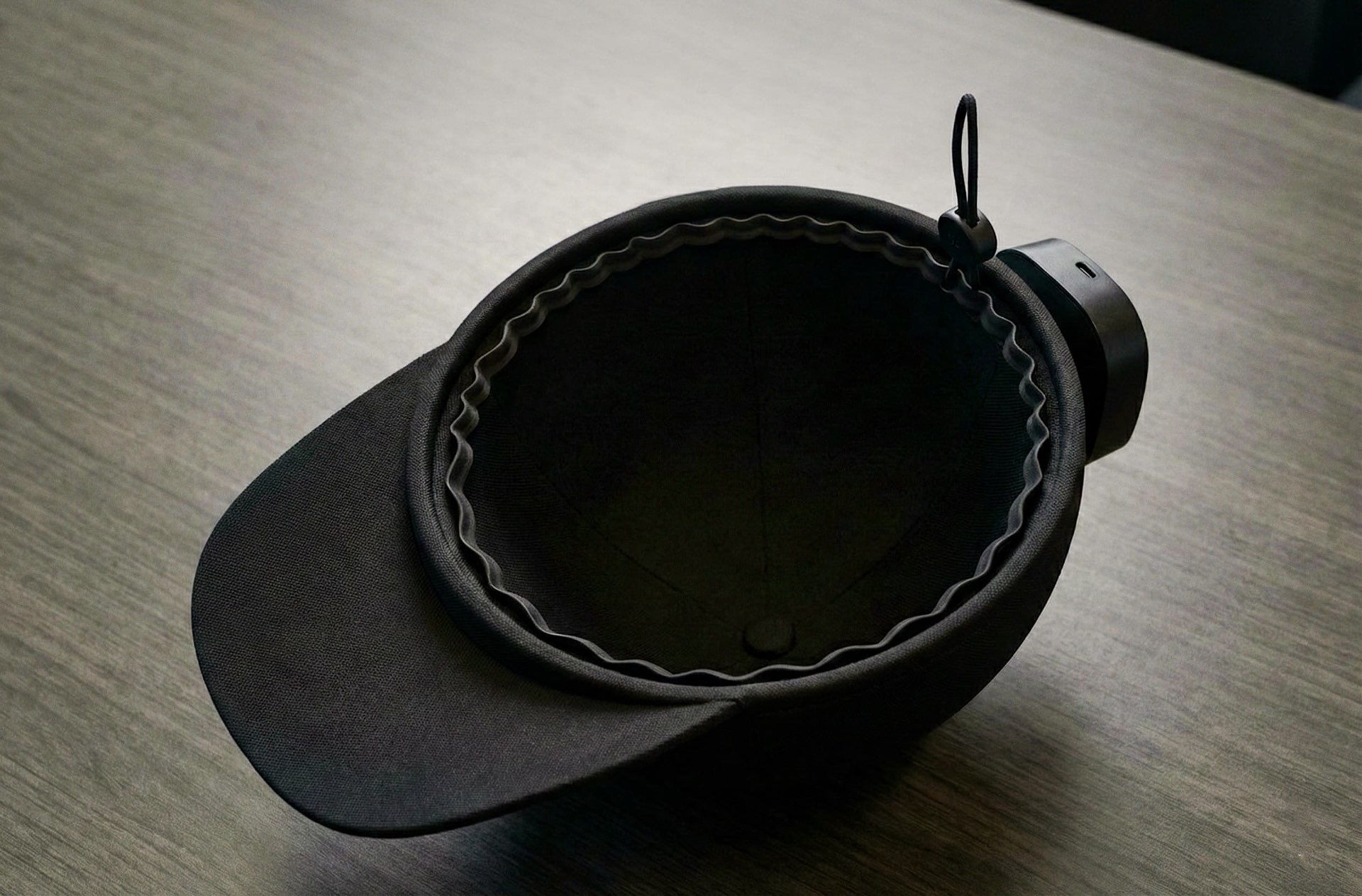 Cap with power module on table